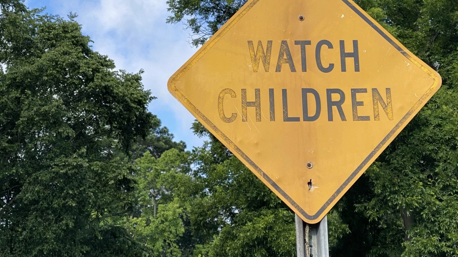 Faded caution sign: Watch Children